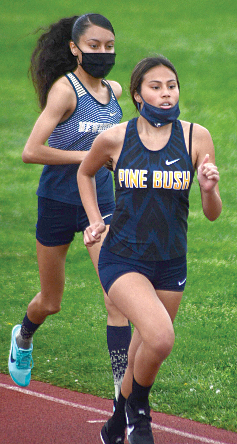 Pine Bush’s Hannah Pawlowski wins the 1,500-meter run ahead of Newburgh’s Melina Sanchez.